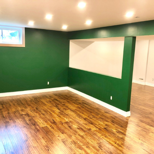 Basement with green walls from a recent basement painting project in Keswick.